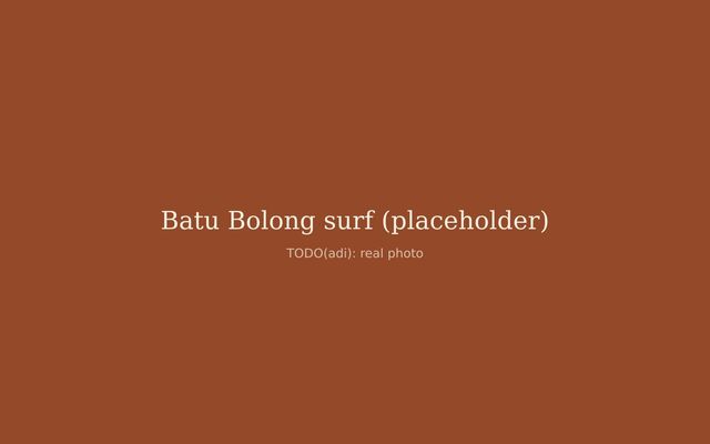 Surfer walking out at Batu Bolong beach, Canggu, at sunrise